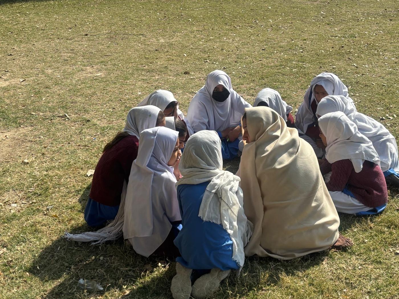 Girls in a circle during a classroom session